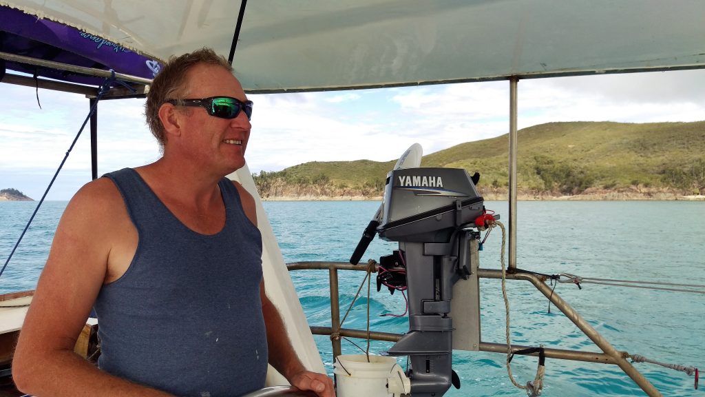 Simon at the helm guiding us into our protected anchorage at Cape Capricorn. 