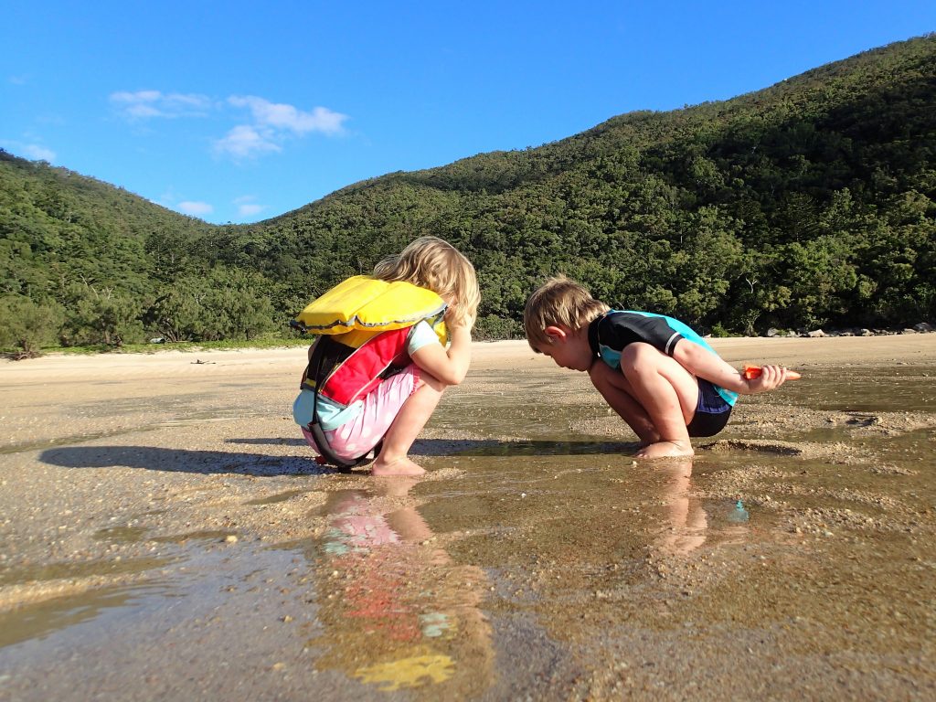 Zach and Freyja have a little chat to a sea snail at the beach on Scawfell Island. August 2017